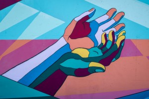 colourful hands painted on wall