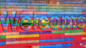 Colourful welcome sign on wall