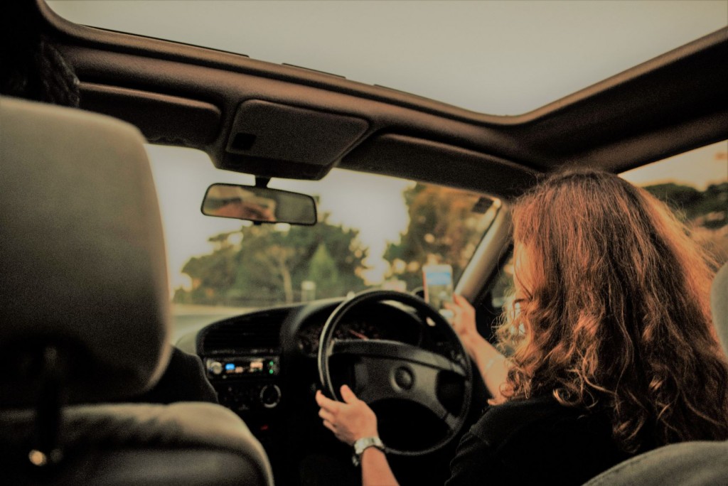 woman in drivers seat of car