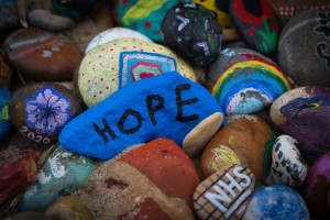 Stone painted blue with the word hope
