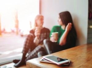 women chatting coffee